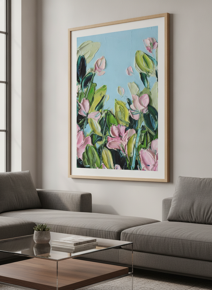 Modern wall art styled above a sofa in a neutral living room
