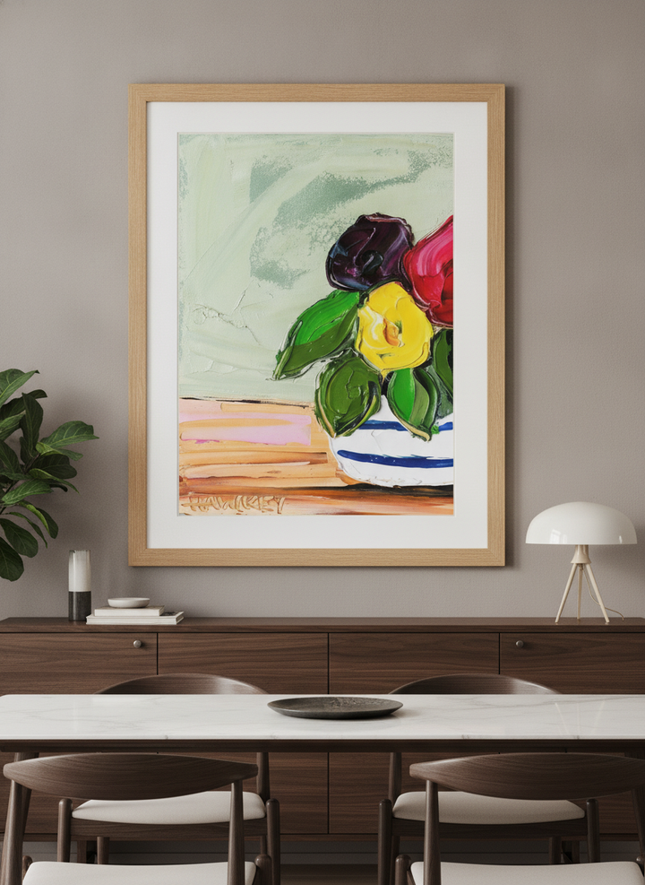 Wall art styled above a dining table in a contemporary home