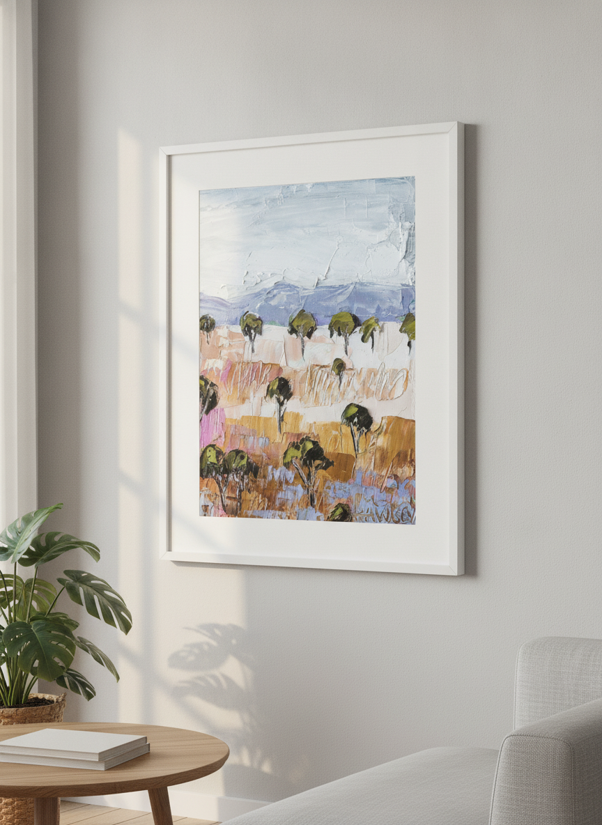 Modern wall art styled above a sofa in a neutral living room