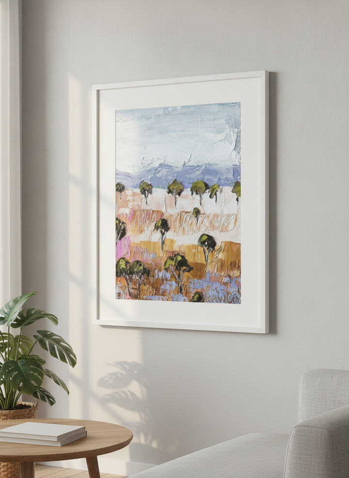Modern wall art styled above a sofa in a neutral living room
