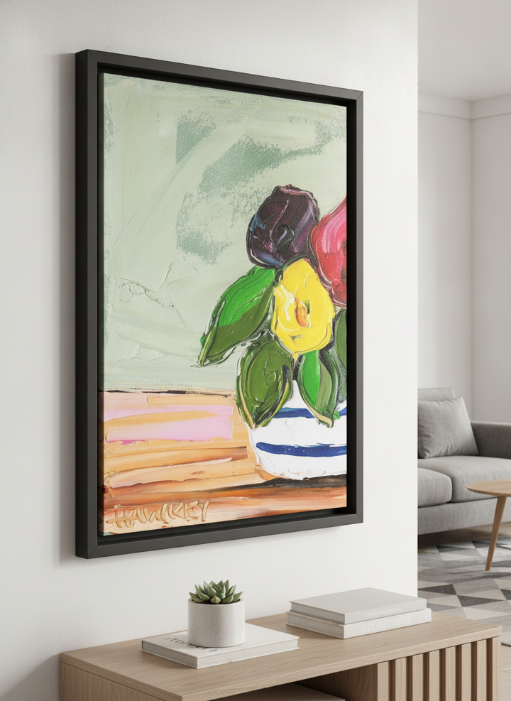 Modern wall art styled above a sofa in a neutral living room