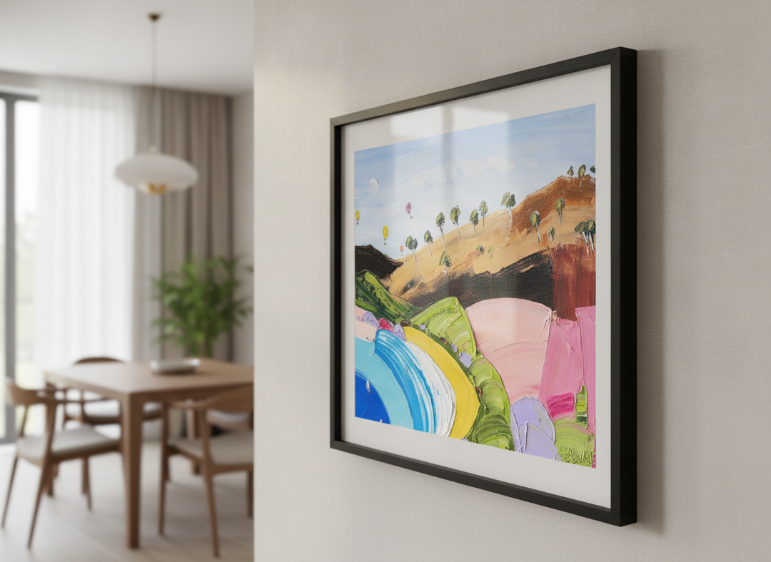Wall art styled above a dining table in a contemporary home