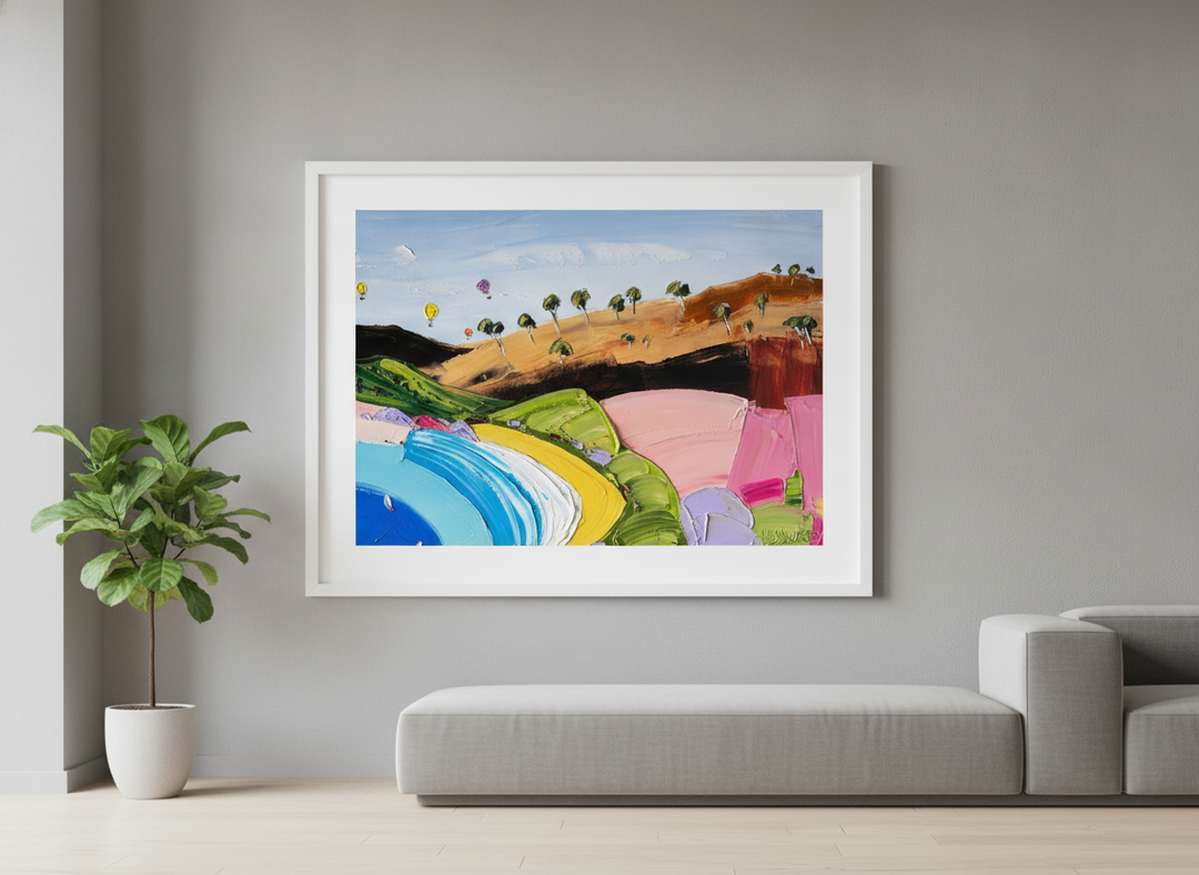 Modern wall art styled above a sofa in a neutral living room