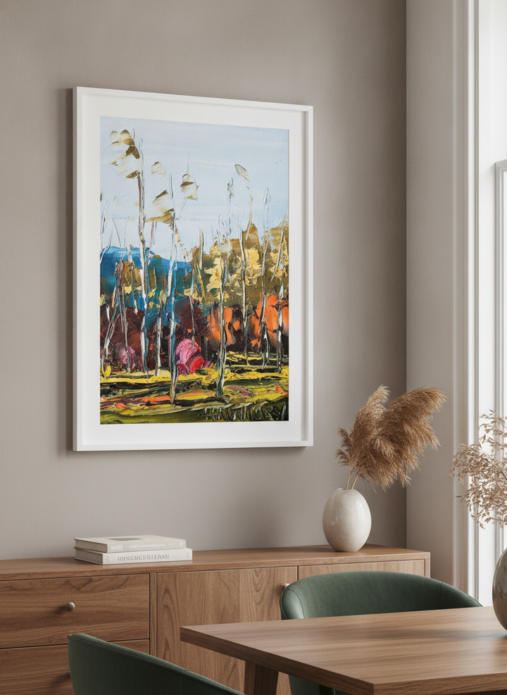 Wall art styled above a dining table in a contemporary home
