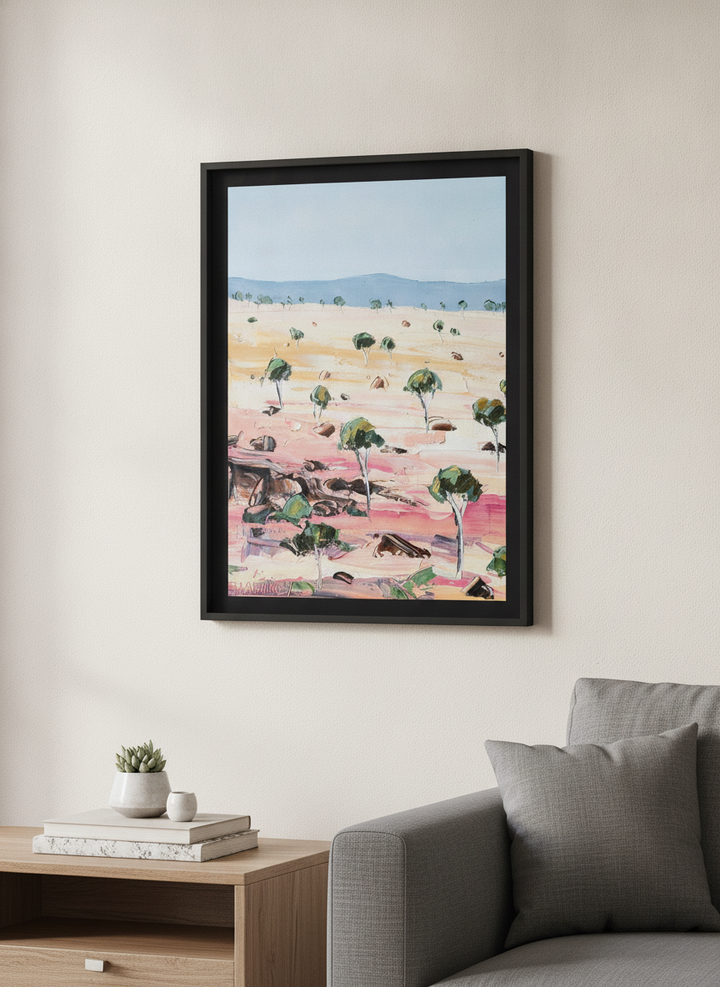 Modern wall art styled above a sofa in a neutral living room