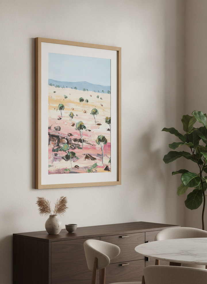Wall art styled above a dining table in a contemporary home