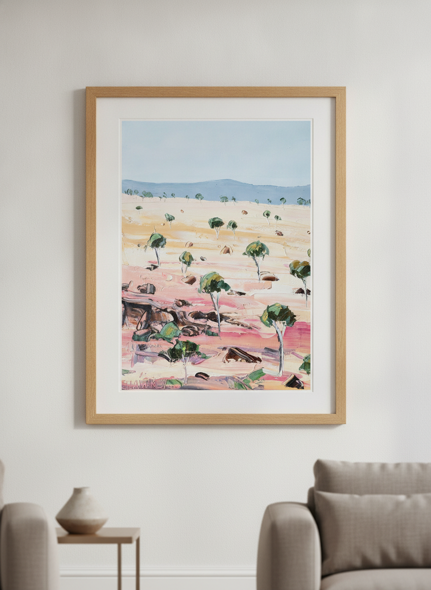 Modern wall art styled above a sofa in a neutral living room