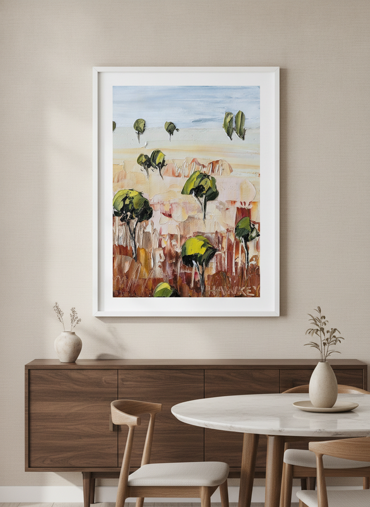 Wall art styled above a dining table in a contemporary home