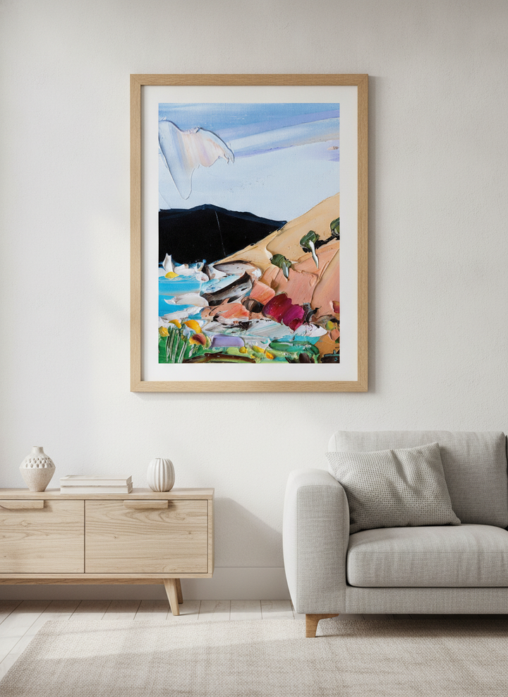 Modern wall art styled above a sofa in a neutral living room
