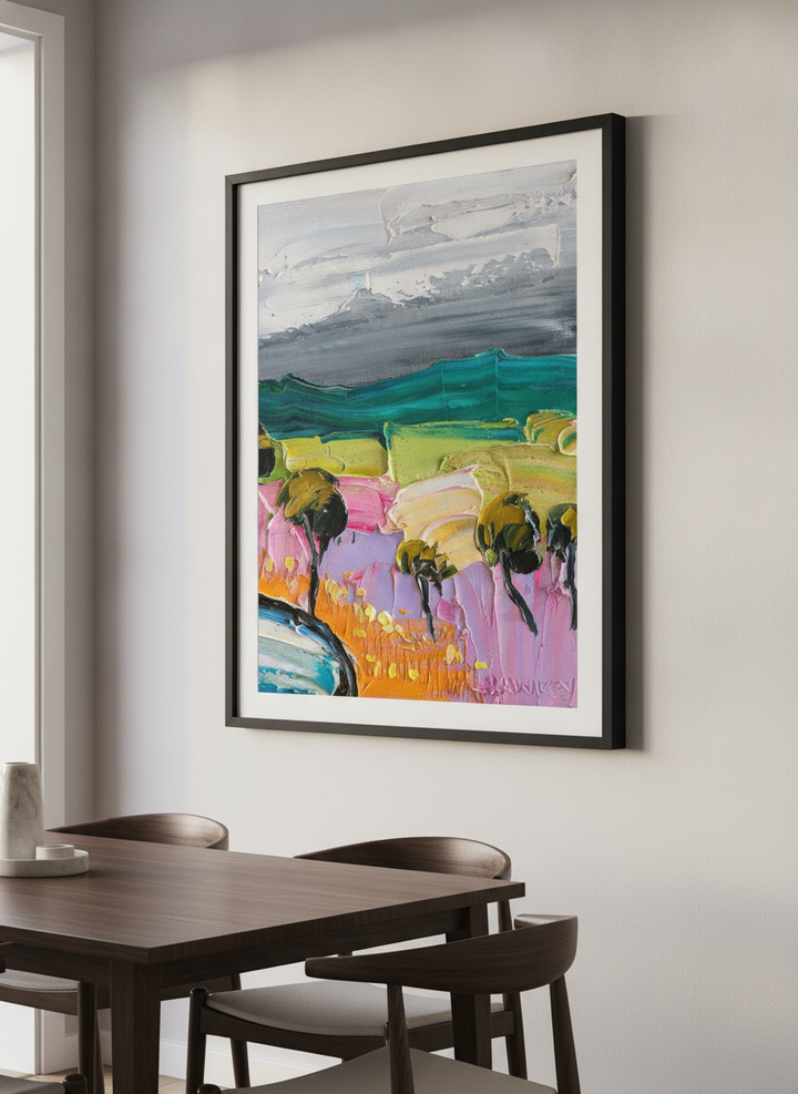 Wall art styled above a dining table in a contemporary home