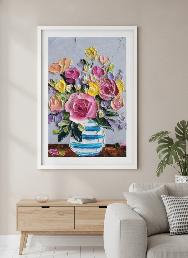 Modern wall art styled above a sofa in a neutral living room