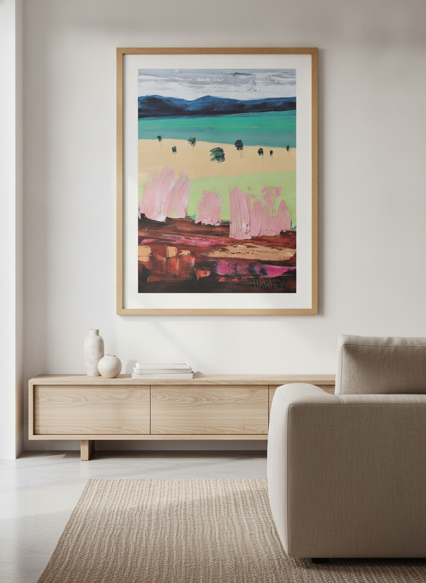 Modern wall art styled above a sofa in a neutral living room