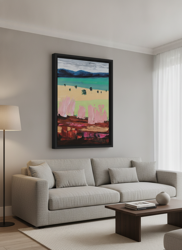Modern wall art styled above a sofa in a neutral living room