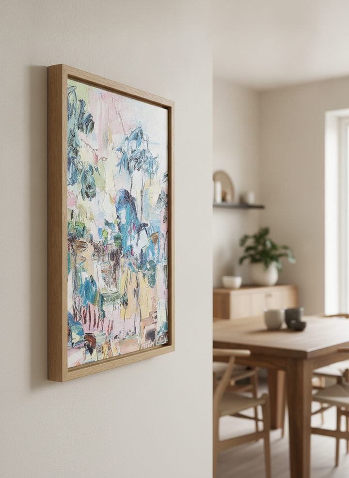 Wall art styled above a dining table in a contemporary home