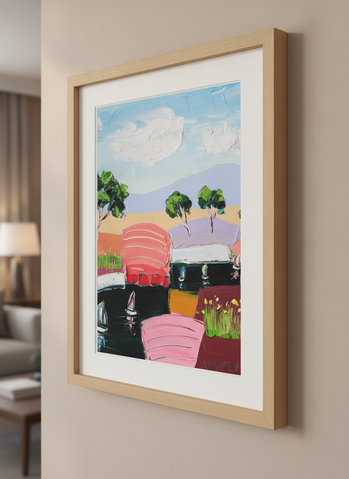Modern wall art styled above a sofa in a neutral living room