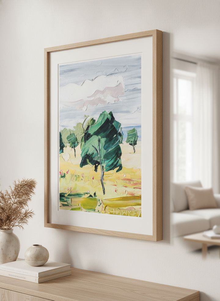 Modern wall art styled above a sofa in a neutral living room