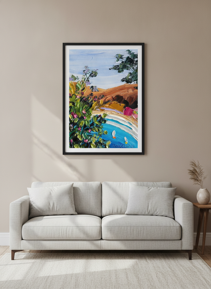 Modern wall art styled above a sofa in a neutral living room