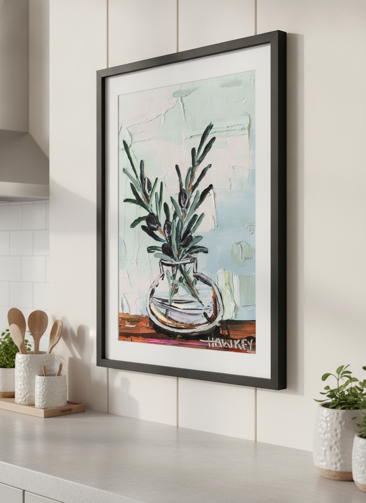 Artwork styled on the wall of a bright modern kitchen