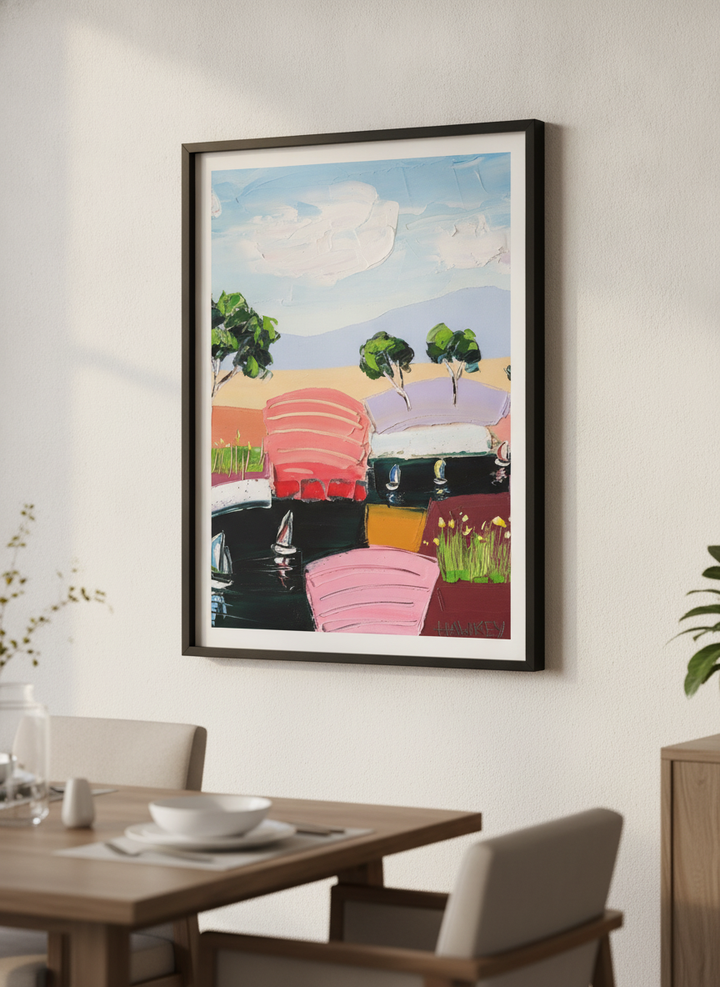 Wall art styled above a dining table in a contemporary home