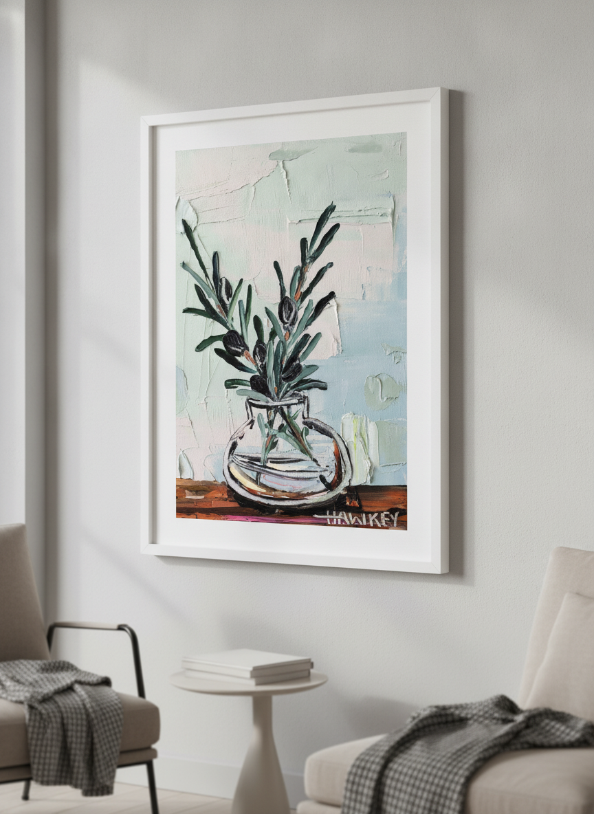 Modern wall art styled above a sofa in a neutral living room