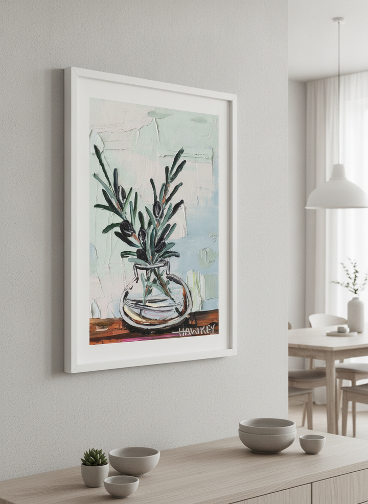 Wall art styled above a dining table in a contemporary home
