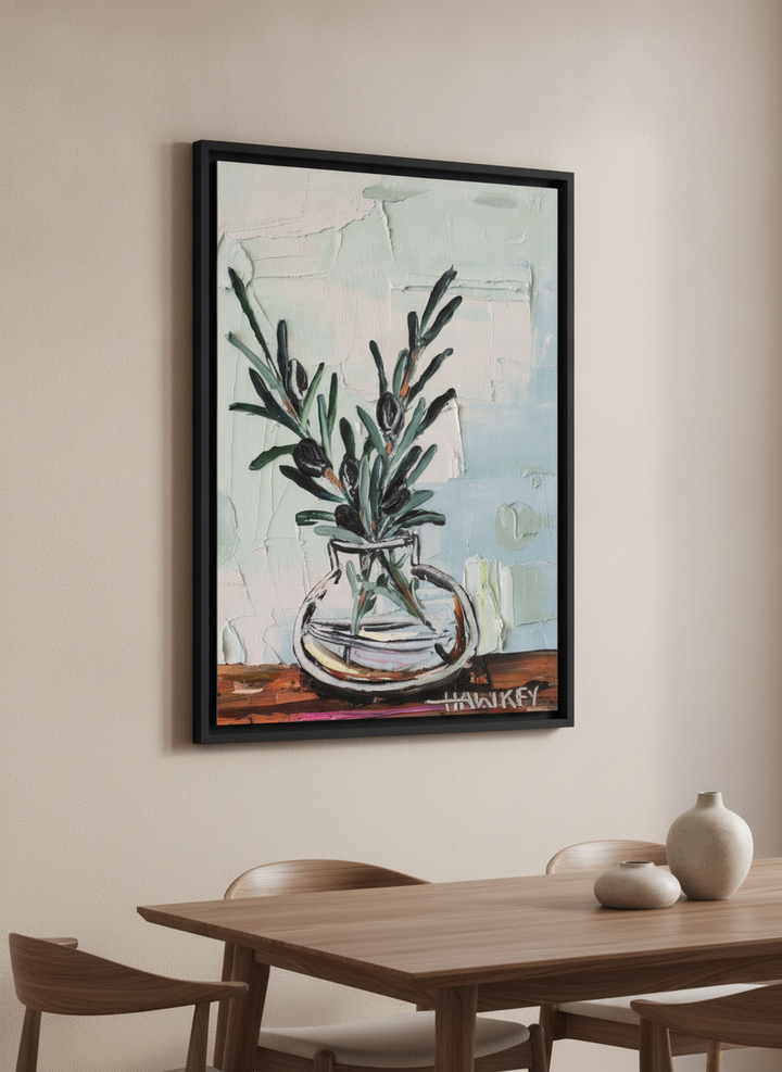 Wall art styled above a dining table in a contemporary home