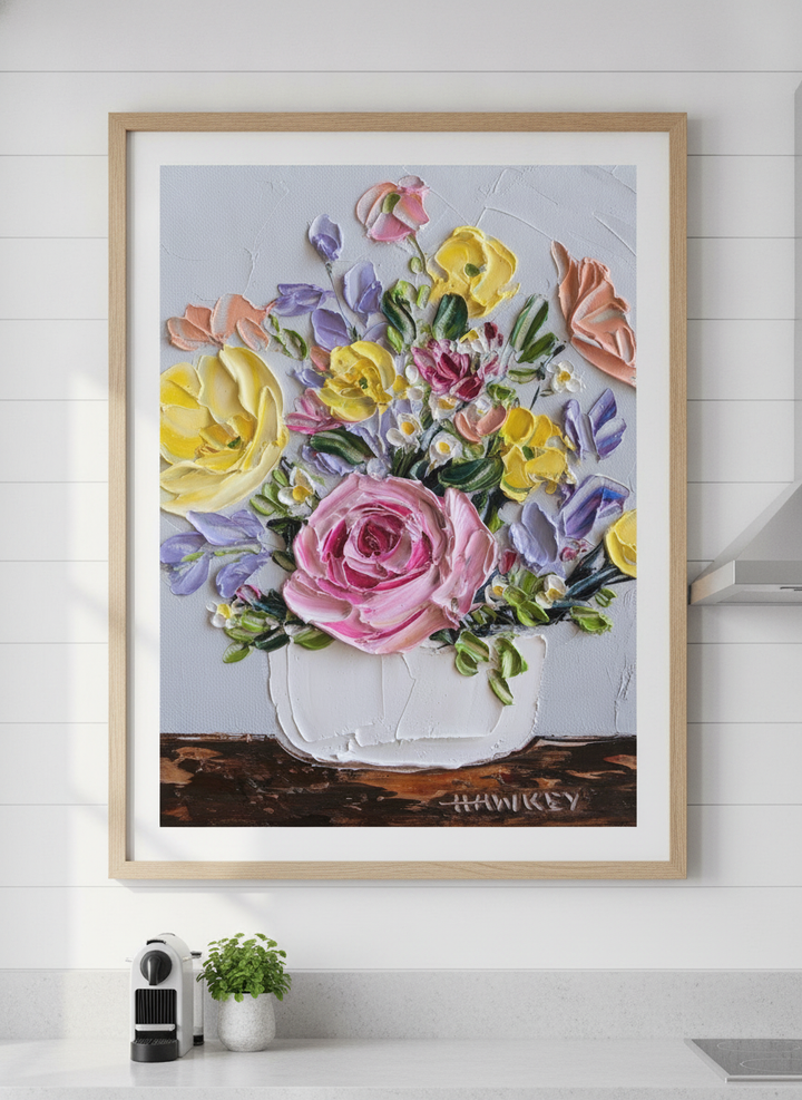Artwork styled on the wall of a bright modern kitchen