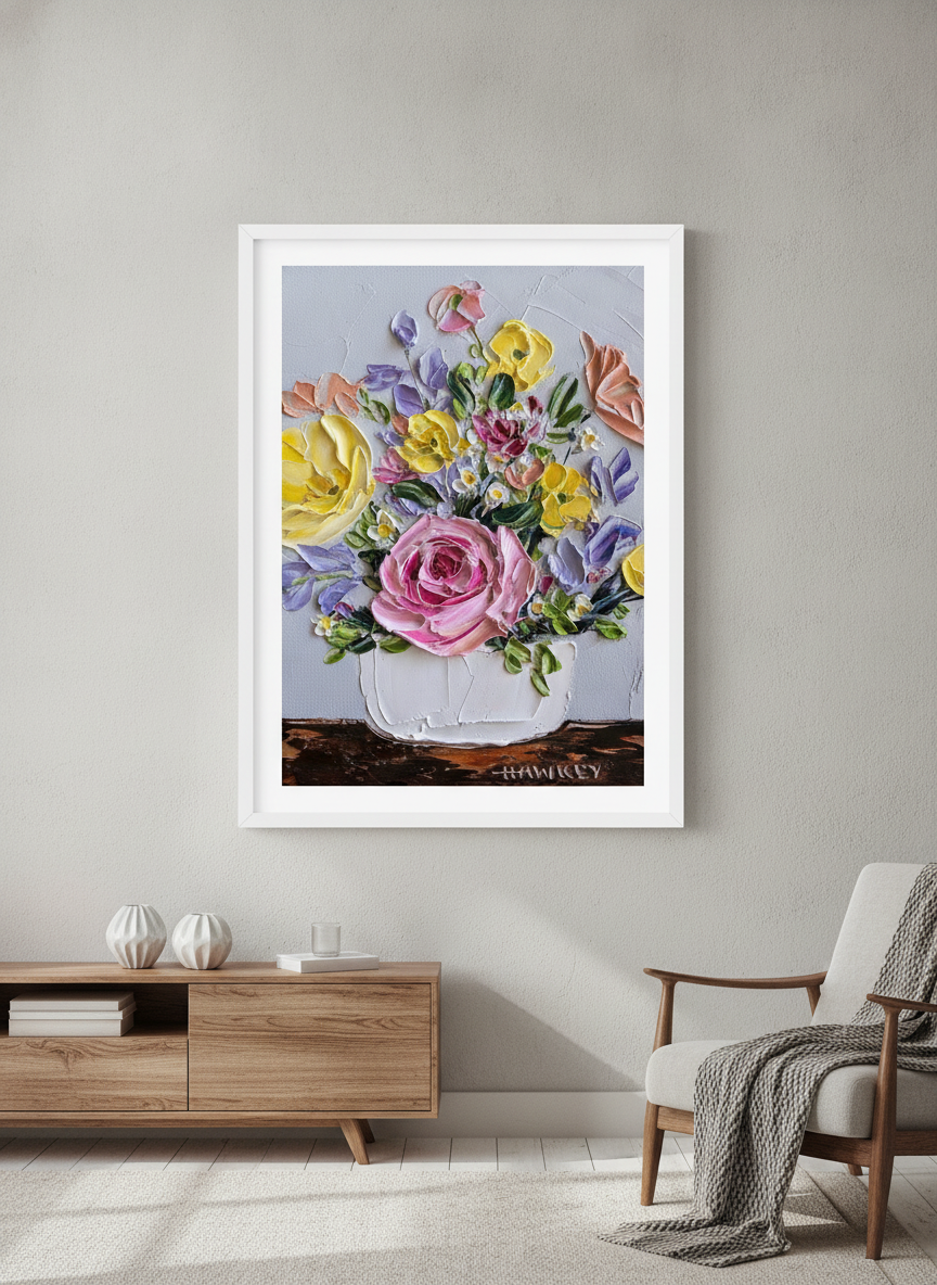 Modern wall art styled above a sofa in a neutral living room