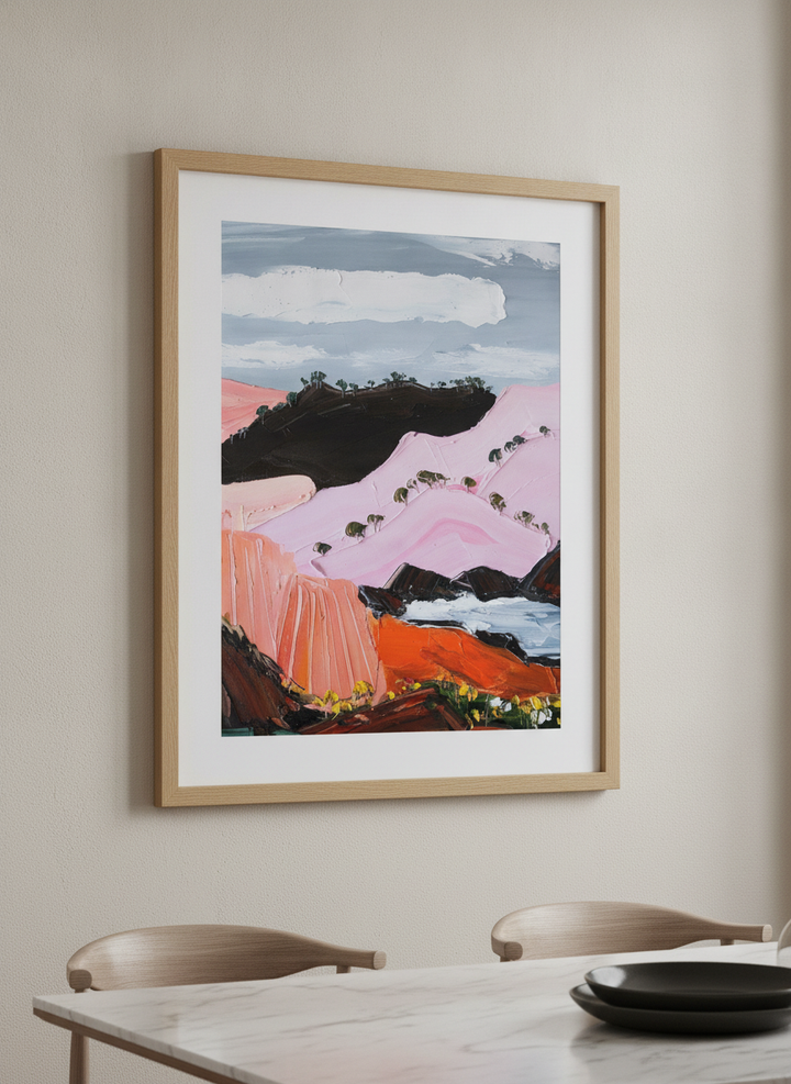 Wall art styled above a dining table in a contemporary home