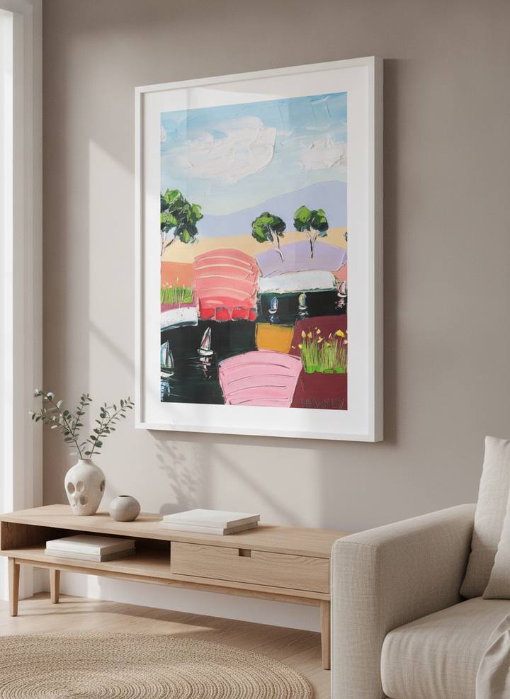 Modern wall art styled above a sofa in a neutral living room