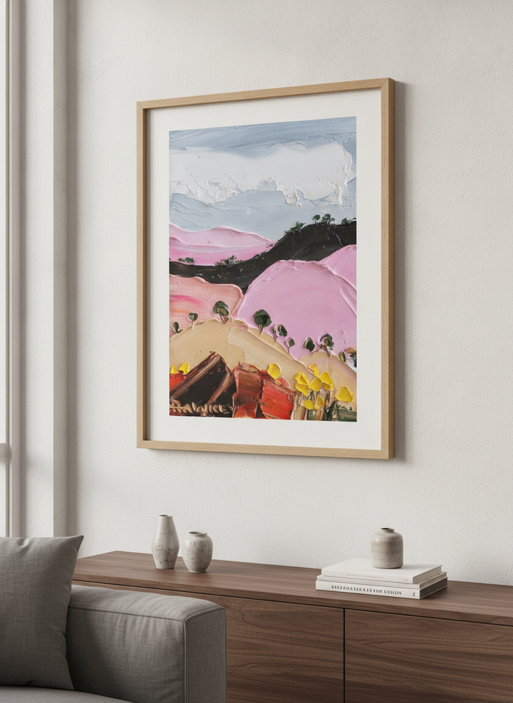 Modern wall art styled above a sofa in a neutral living room