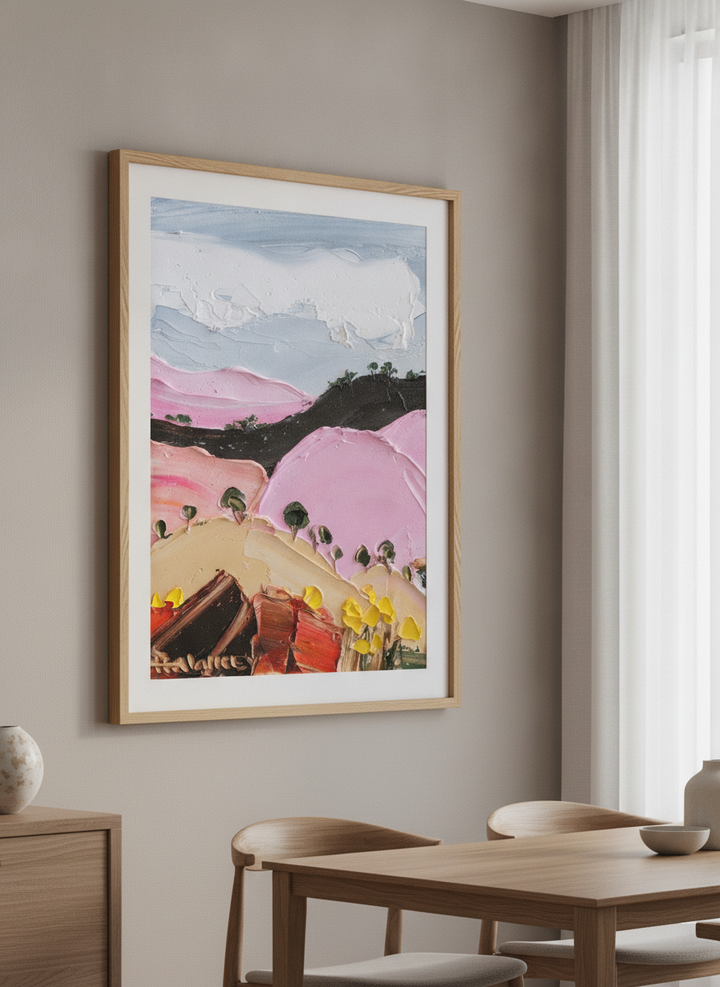 Wall art styled above a dining table in a contemporary home
