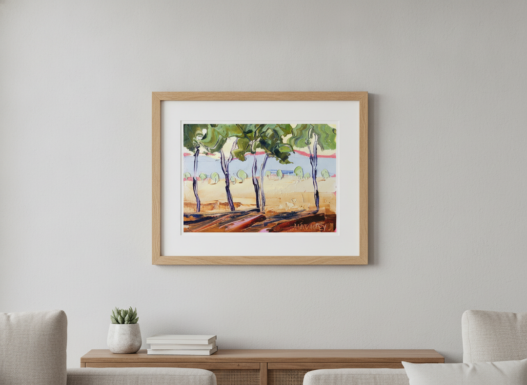 Modern wall art styled above a sofa in a neutral living room