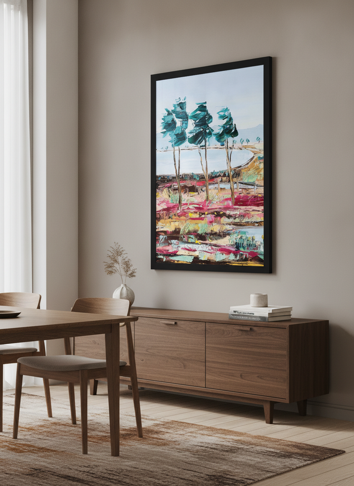Wall art styled above a dining table in a contemporary home