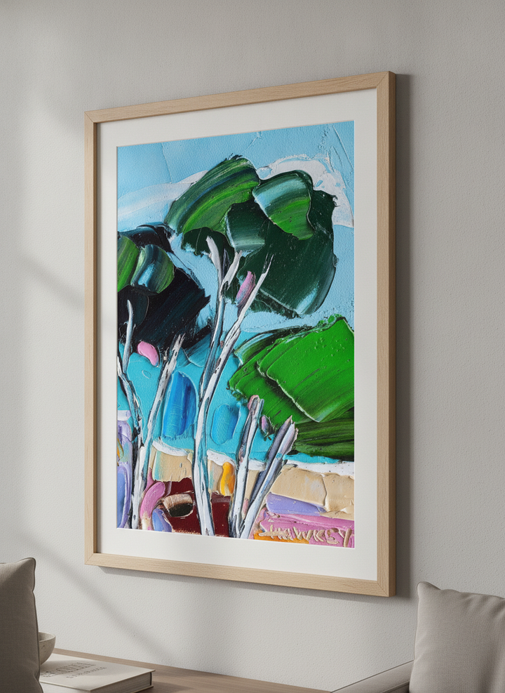 Modern wall art styled above a sofa in a neutral living room