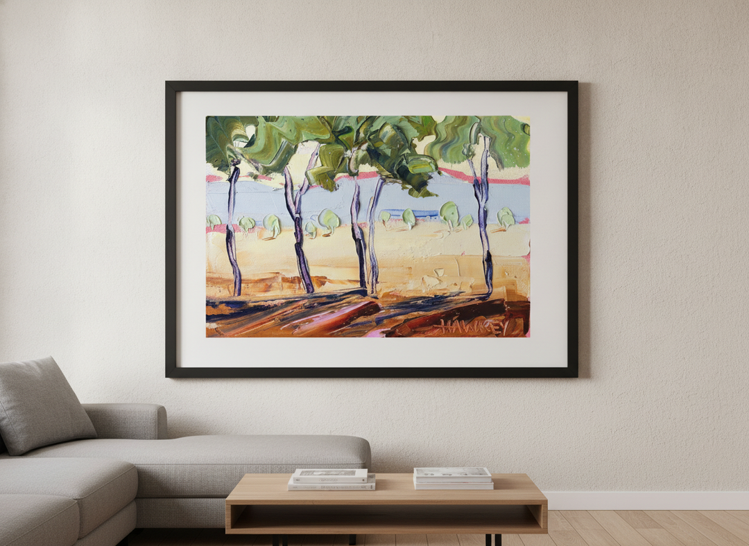 Modern wall art styled above a sofa in a neutral living room