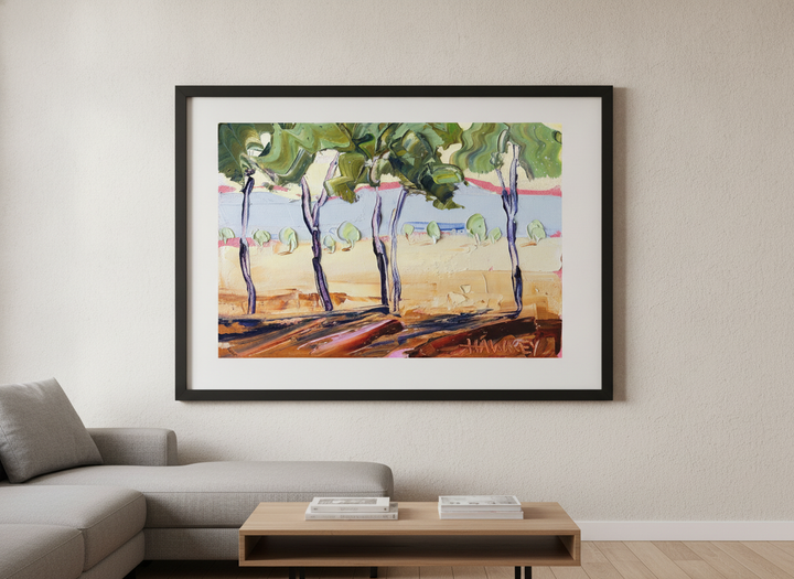 Modern wall art styled above a sofa in a neutral living room