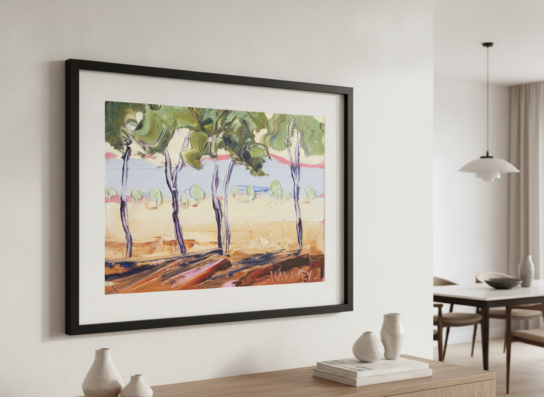 Wall art styled above a dining table in a contemporary home