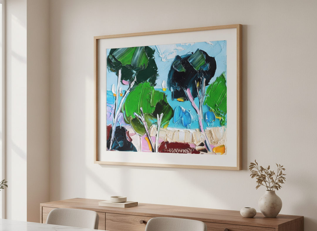 Wall art styled above a dining table in a contemporary home