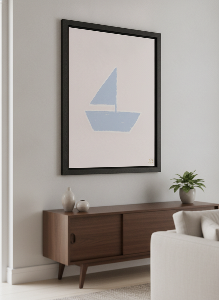 Modern wall art styled above a sofa in a neutral living room