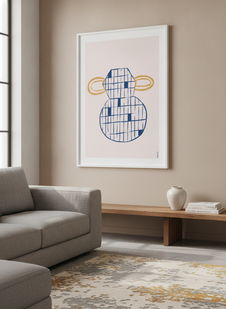 Modern wall art styled above a sofa in a neutral living room