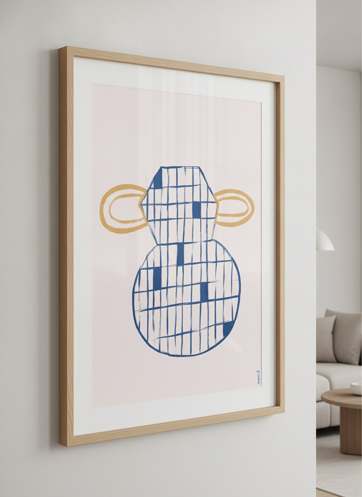 Modern wall art styled above a sofa in a neutral living room