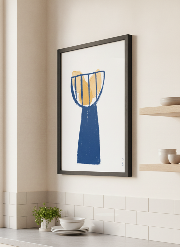 Artwork styled on the wall of a bright modern kitchen