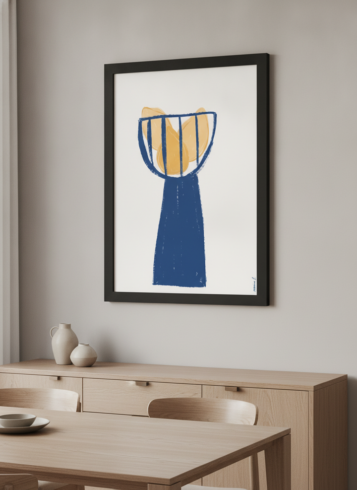 Wall art styled above a dining table in a contemporary home