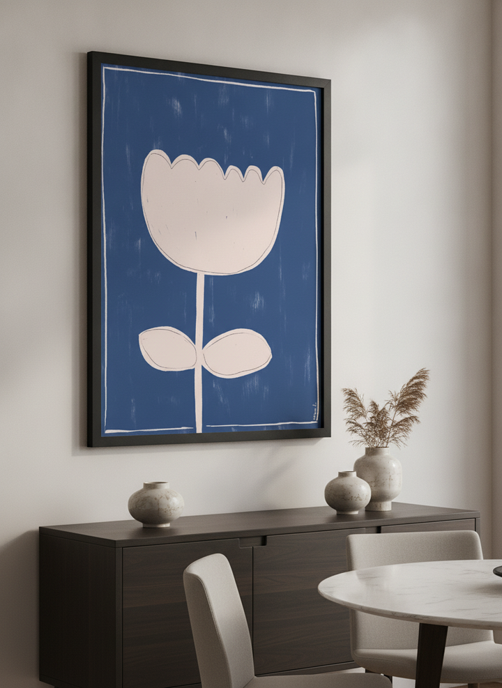 Wall art styled above a dining table in a contemporary home