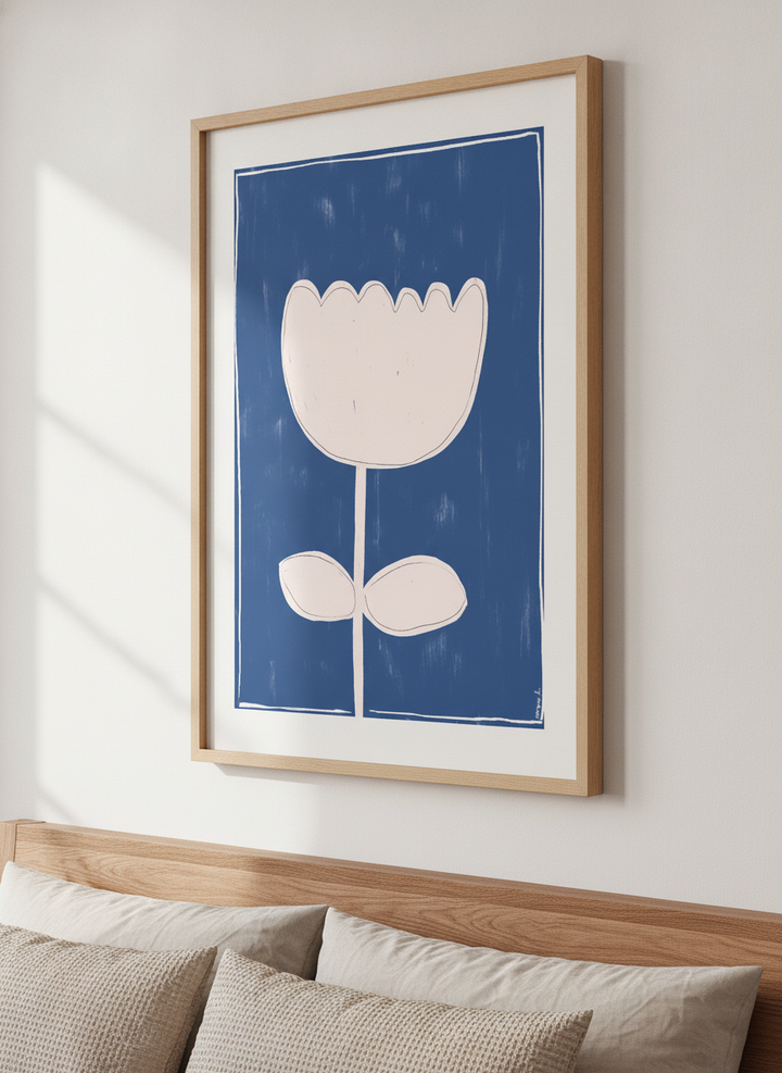 Minimalist artwork displayed in a calm, light-filled bedroom interior