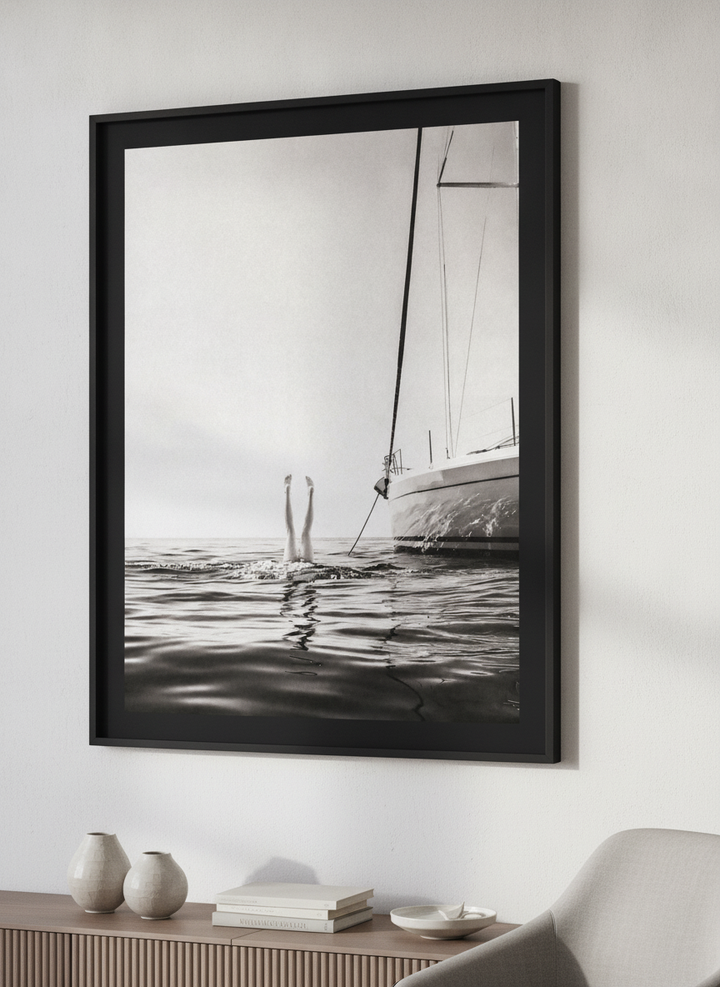 Modern wall art styled above a sofa in a neutral living room