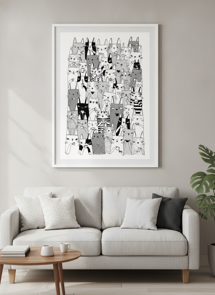Modern wall art styled above a sofa in a neutral living room