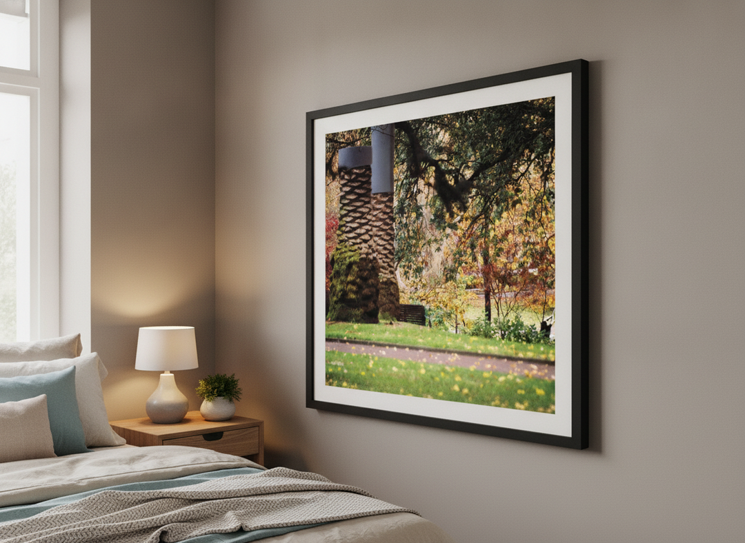 Minimalist artwork displayed in a calm, light-filled bedroom interior