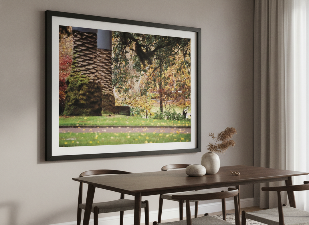 Wall art styled above a dining table in a contemporary home